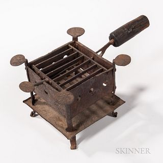 Wrought Iron Brassier, late 18th/early 19th century, the square body with pierced sides and iron grate, on a base with four curled feet