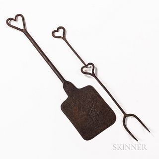 Two Heart-decorated Wrought Iron Hearth Implements, 19th century, a peel and a two-tined fork, lg. to 18 in.