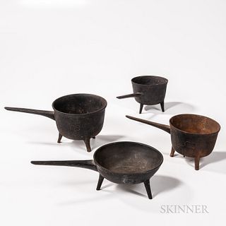Four Cast Iron Skillets, late 18th/19th century, each with three legs and a tapering handle, dia. to 8 in.