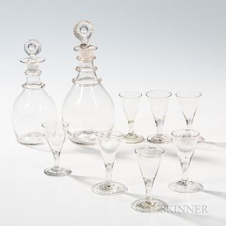 Two Blown Glass Decanters with Applied Ring Decoration and Seven Blown Wines, America, 19th century, each decanter with sunburst stoppe