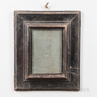 Early Black-painted Mirror, probably England, 18th century, with deeply molded liner surrounded by flatter frame with molded edge, 17 1