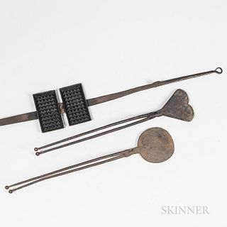 Three Cast and Wrought Iron Waffle and Wafer Irons, 18th/19th century, a rectangular and a heart-shaped waffle iron, and a round wafer