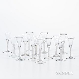 Fourteen Early Blown Wineglasses, early 19th century, all with cottontwist stems, most with trumpet-form and some with bell-form bowls,