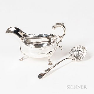 Georgian Sterling Silver Gravy Boat and Ladle, London, mid-18th century, the gravy boat with worn hallmarks, shaped rim, slipper feet a