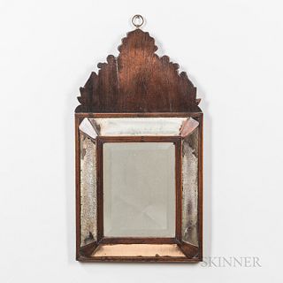 Walnut Mirror, England, late 19th century, the scrolled crest above a rectangular reeded double frame with carved panels and beveled gl