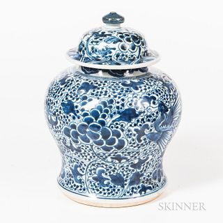 Blue and White Decorated Porcelain Jar, China, 19th century, with domed cover, the bulbous form decorated with exotic birds and flowers