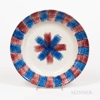 Red and Blue Rainbow Spatterware Plate, England, 19th century, the textured rim with border of alternating red and blue sections all ce