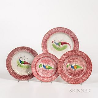 Four Red Spatterware "Peafowl" Pattern Plates, England, 19th century, two larger plates with red spatter rims centering peafowls with b