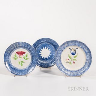 Three Small Blue Spatterware Plates, England, 19th century, including one "sunburst" pattern with allover blue and fourteen-point star-