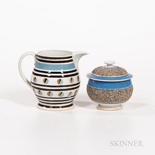 Two Pieces of Slip-decorated Pearlware, England, 19th century, a baluster-form pitcher with two rows of blue and brown "cat's eyes," an