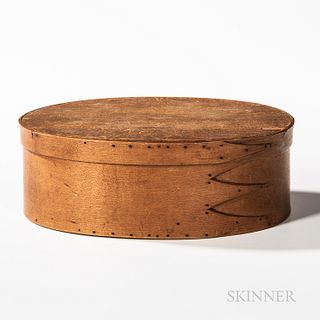 Shaker Covered Oval Box, 19th century, with three swallowtails on base, (top with chips), ht. 3 3/4, wd. 11, dp. 8 in.  Provenance: The