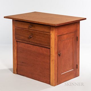 Shaker Pine, Maple, and Cherry Sewing Cabinet, c. 1850, the overhanging top above a case of two thumb-molded drawers and a hinged cupbo