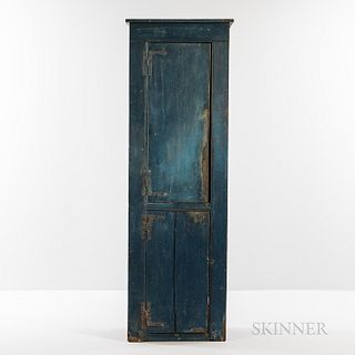 Small Blue-painted Pine Chimney Cupboard, late 18th century, the cockbeaded case of two hinged doors opening to concave shelves in the