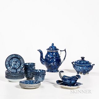 Group of Blue Transfer-decorated Teaware, England, 19th century, including a teapot depicting two men engaged in business, a gravy boat