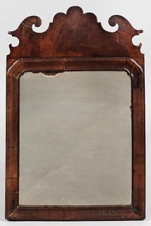 Queen Anne Walnut Veneer Mirror, probably England, late 18th century, scrolled crest above a shaped molded liner, old glass, ht. 18 in.