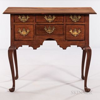 Queen Anne Walnut Dressing Table, Massachusetts, c. 1740-60, the molded overhanging top above a case of six thumb-molded drawers and ca