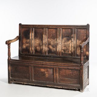 Oak Joined Bench, England, late 17th/early 18th century, with molded recessed panels and hinged lift seat flanked by shaped arms, old s