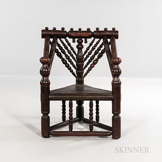 Oak Spindle-back Armchair, England, 17th century, the turned crest rail topped by turned knobs, above elaborate turned spindles emanati