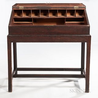 Mahogany Desk-on-frame, possibly New England, c. 1790-1800, the lift top with molded bookrest opens to an interior of compartments and