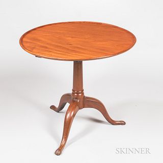 Mahogany Tilt-top Tea Table, attributed to John Goddard, c. 1760-90, the dished top on a columnar pillar and cabriole legs ending in cl