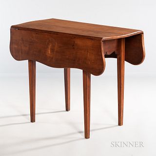 Federal Cherry Serpentine Drop-leaf Table, New England, c. 1795-1810, the top on a cutout apron joining square molded tapering legs, re