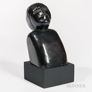 Carved Ebonized Bust of a Man, 19th century, with stylized features and a reclining upper posture, on custom black plinth, overall ht.