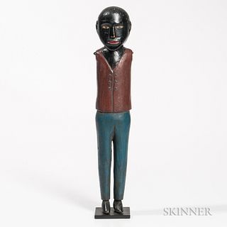 Carved and Polychrome Painted Figure of Black Man, c. 1900, with red vest and blue pants, possibly a whirligig missing its paddles, ht.