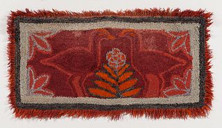Fringed Hooked Rug with Two Birds, America, late 19th century, the red birds flanking a central flowering plant against a red backgroun