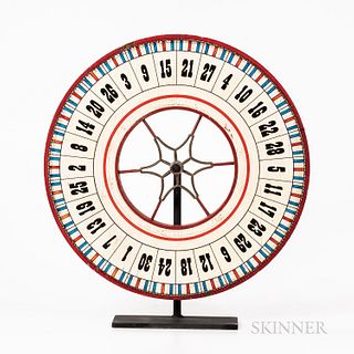Red-, White-, and Blue-painted Wheel of Chance, America, late 19th century, with black numbers on a white ground, on stand, dia. 25 in.