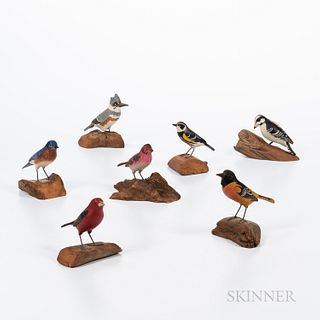 Seven Carved and Painted Songbirds, probably third quarter 20th century, most signed by the artist "L. SPRAGUE," most species identifie