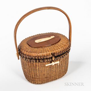 Nantucket Basket Purse, signed "Farnum," dated "1978," the lid centering an applied carved whale, (imperfections), ht. 7 in.