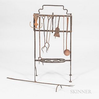 Wrought Iron Roasting Rack and Ten Hearth Tools, mostly 19th century, the rack with adjustable game holder on a pair of arched legs wit