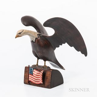 Carved and Painted Wood Spreadwing Eagle, Richard Orcutt, c. 1980, the eagle stands atop an American flag-adorned pedestal, signed on t