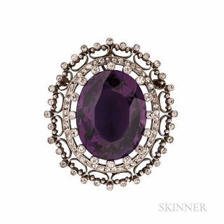 Edwardian Amethyst and Diamond Pendant/Brooch, set with a large oval-cut amethyst measuring approx. 24.00 x 19.00 x 12.20 mm, framed by