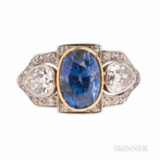 Art Deco Sapphire and Diamond Ring, bezel-set with an oval-cut sapphire weighing 2.94 cts., flanked by bezel-set pear-shape diamonds, a