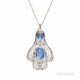 Edwardian Platinum, Sapphire, and Diamond Pendant, bezel-set with an oval cabochon measuring approx. 13.00 x 10.30 x 7.40 mm, a circula