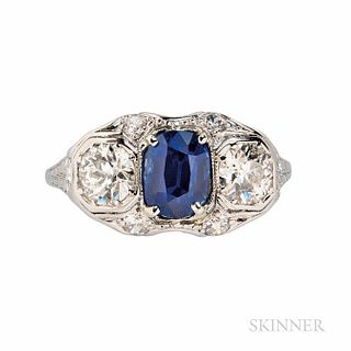 Art Deco Platinum, Sapphire, and Diamond Ring, the cushion-cut sapphire weighing 1.74 cts., flanked by old European-cut diamonds, appro