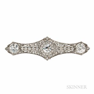Art Deco Platinum and Diamond Brooch, bezel-set with old European-cut diamonds each weighing approx. 2.00 cts., and centering an old Eu