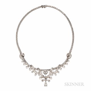 Platinum and Diamond Necklace, c. 1950s, suspending a pear-shape diamond weighing approx. 1.40 cts., and pear-, full-, baguette, and ta