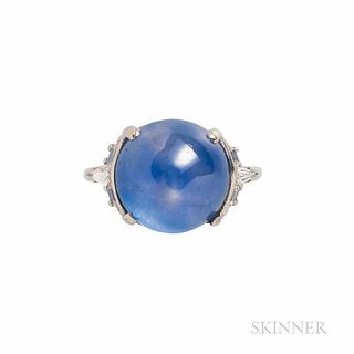 Platinum, Star Sapphire, and Diamond Ring, set with a round double cabochon sapphire measuring approx. 13.83 x 13.65 x 10.67 mm, and we