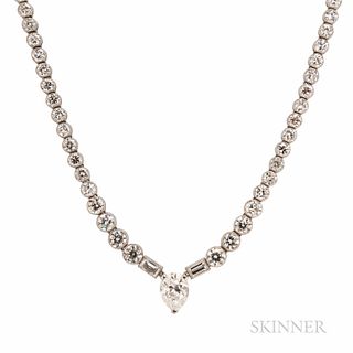 Platinum and Diamond Necklace, set with a pear-shape diamond weighing approx. 1.50 cts., flanked by baguettes, and joined to bezel-set