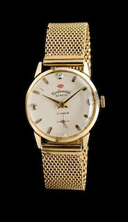 * A 14 Karat Yellow Gold Wristwatch, Continental Geneva,