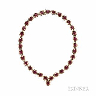 Ruby and Diamond Necklace, composed of thirty-two oval rubies framed by full-cut diamonds, approx. total diamond wt. 8.50 cts., 14kt go
