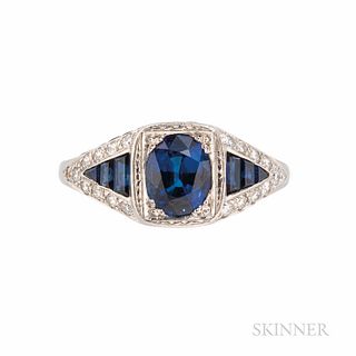 James Breski Platinum, Sapphire, and Diamond Ring, set with an oval-cut sapphire weighing 1.87 cts., the shoulders and gallery set with