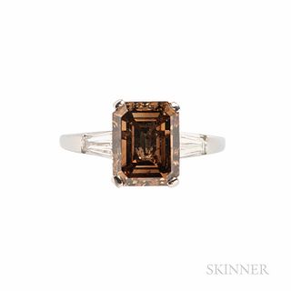Jabel Platinum and Colored Diamond Solitaire, prong-set with an emerald-cut cognac diamond weighing approx. 3.42 cts., flanked by taper