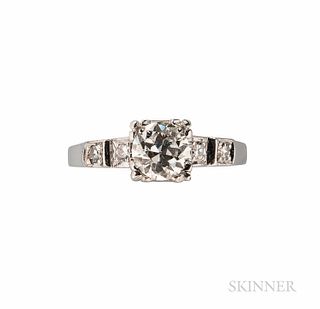 Platinum and Diamond Solitaire, set with a transitional-cut diamond weighing 0.73 cts., the shoulders set with single-cut diamond melee