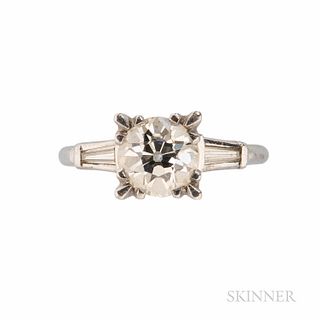 Platinum and Diamond Solitaire, set with an old European-cut diamond weighing approx. 1.65 cts., flanked by tapered baguettes, size 7.