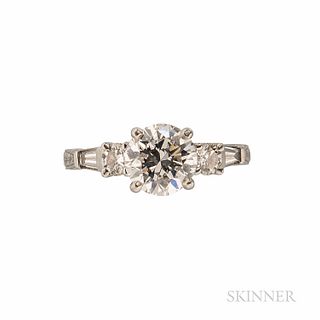 Platinum and Diamond Solitaire, prong-set with a full-cut diamond weighing approx. 1.70 cts., flanked by full- and tapered baguette-cut