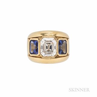 18kt Gold, Diamond, and Tanzanite Ring, the emerald-cut diamond weighing 2.87 cts., flanked by tanzanites, size 6 1/4. Note: Accompanie