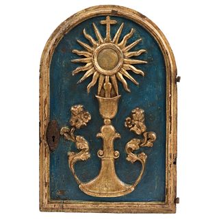 TABERNACLE DOOR, MÉXICO, 19th century, Carved wood and monstrance in relief with iron applications and gold enamel, 16.9 x 25.1" (43 x 64 cm)